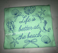 Life is better at the beach - blue writing